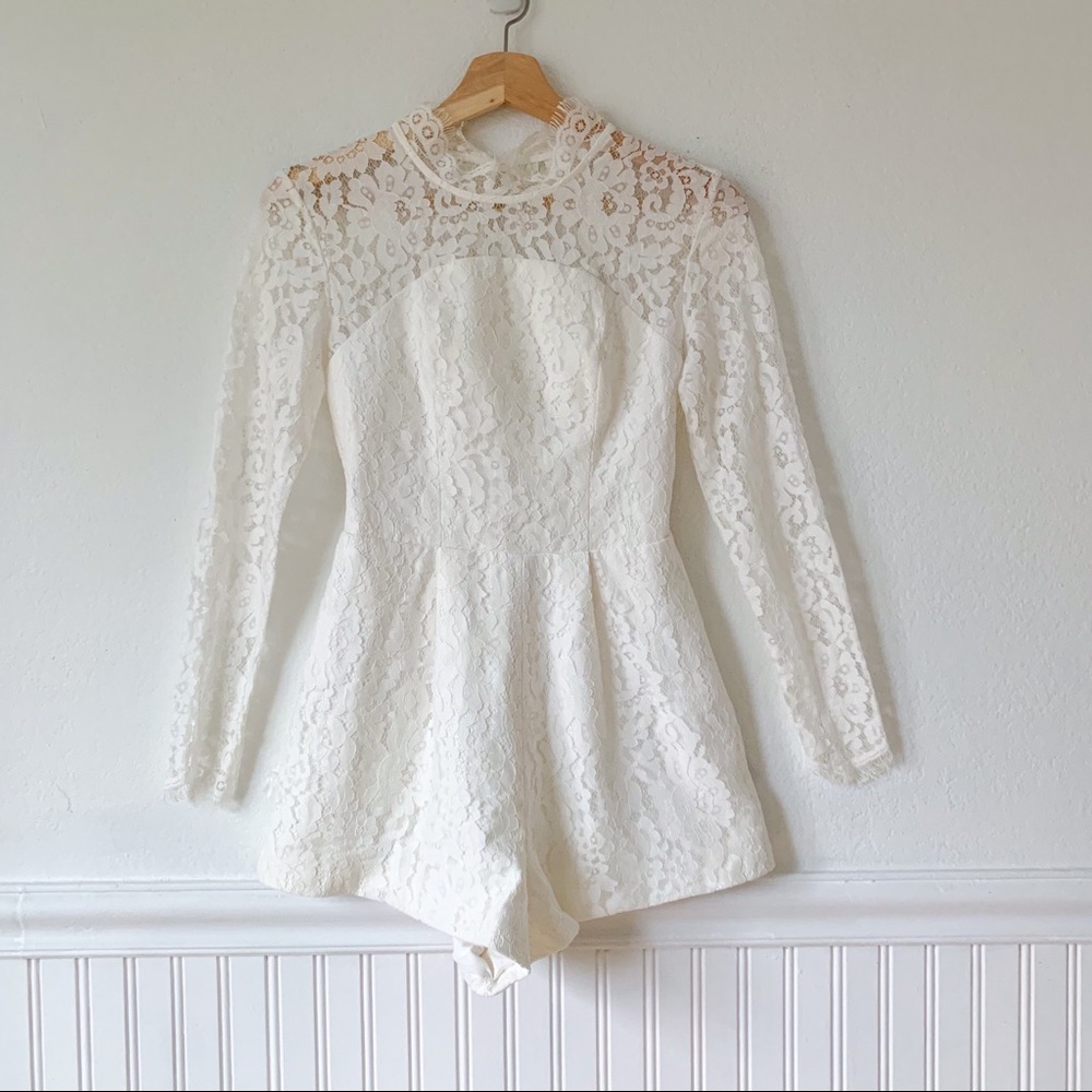 Keepsake white lace up long slv mock neck romper